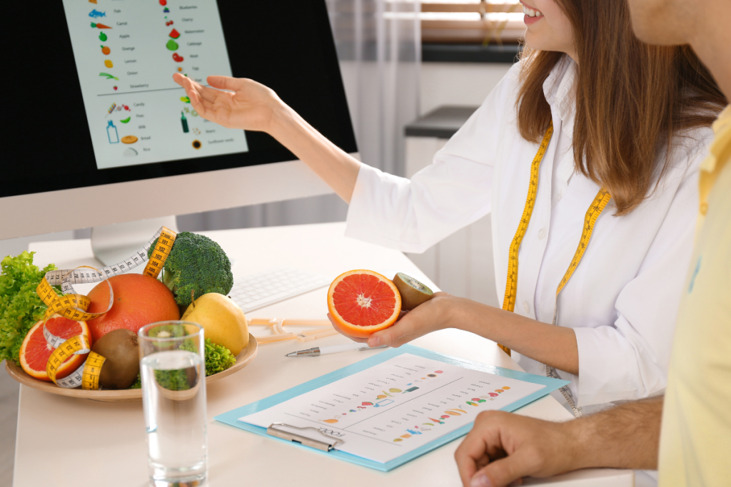 Young nutritionist consulting patient