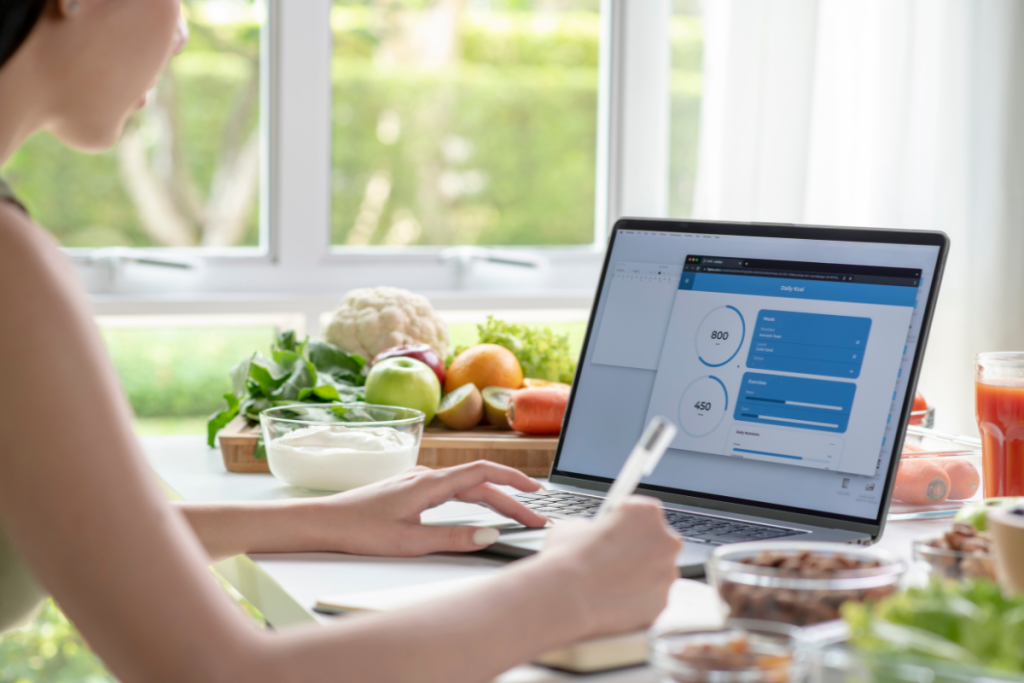 Women Nutritionist checking data from laptop